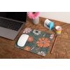 mockup of a mousepad lying on a rustic table next to a flower vase 27554 (6)