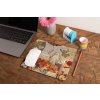 mockup of a mousepad lying on a rustic table next to a flower vase 27554 (1)