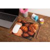 mockup of a mousepad lying on a rustic table next to a flower vase 27554 (3)