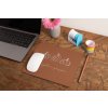 mockup of a mousepad lying on a rustic table next to a flower vase 27554 (6)