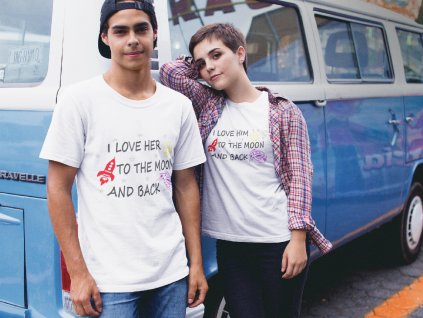 couple wearing different round neck tees mockup against a blue van a16443