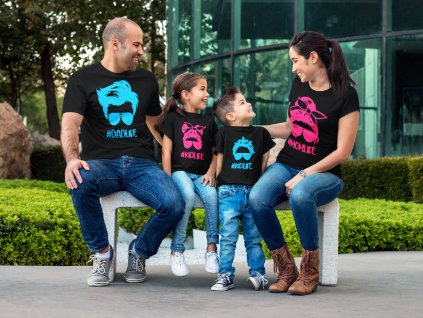 couple with kids wearing different tees mockup sitting on a bench while outdoors a15484 (1)