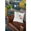 throw pillow mockup lying over a retro leather couch 23555