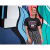 tee mockup of a smiling girl in front of a wall with colorful illustrations 26646 (1)