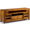 Masivní televizní stolek z exotického dřeva v medově hnědé barvě s mosazným kováním