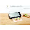 VS2100 foodsaver black base light silver lid with food angle lifestyle 2