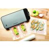VS2100 foodsaver black base light silver lid with food overhead lifestyle 1