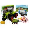 223779 traktor se tremi privesy sklizeni sena zeleny
