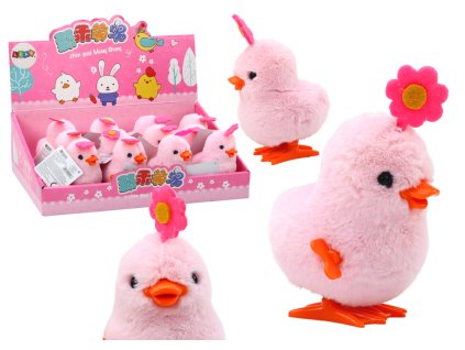 Ugró rózsaszín csaj egy hajtáson egy virággal