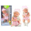 Bambola neonata con cappellino e bavaglino rosa