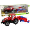 Traktor s třecím pohonem a pluhem červený