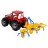 Traktor s trenjem in s senenim grabljem rdeč