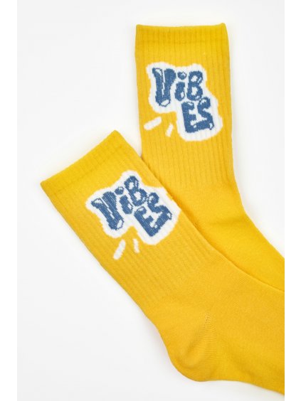 Žluté vysoké ponožky s módním potiskem
