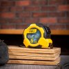 Ocelové měřicí pásmo 5 m/25 mm Deli Tools EDL3797Y (žluté)