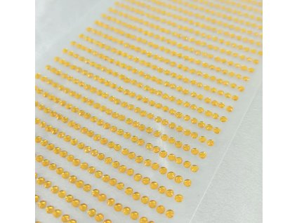 Adhesive decorative glitter on a sheet, gold