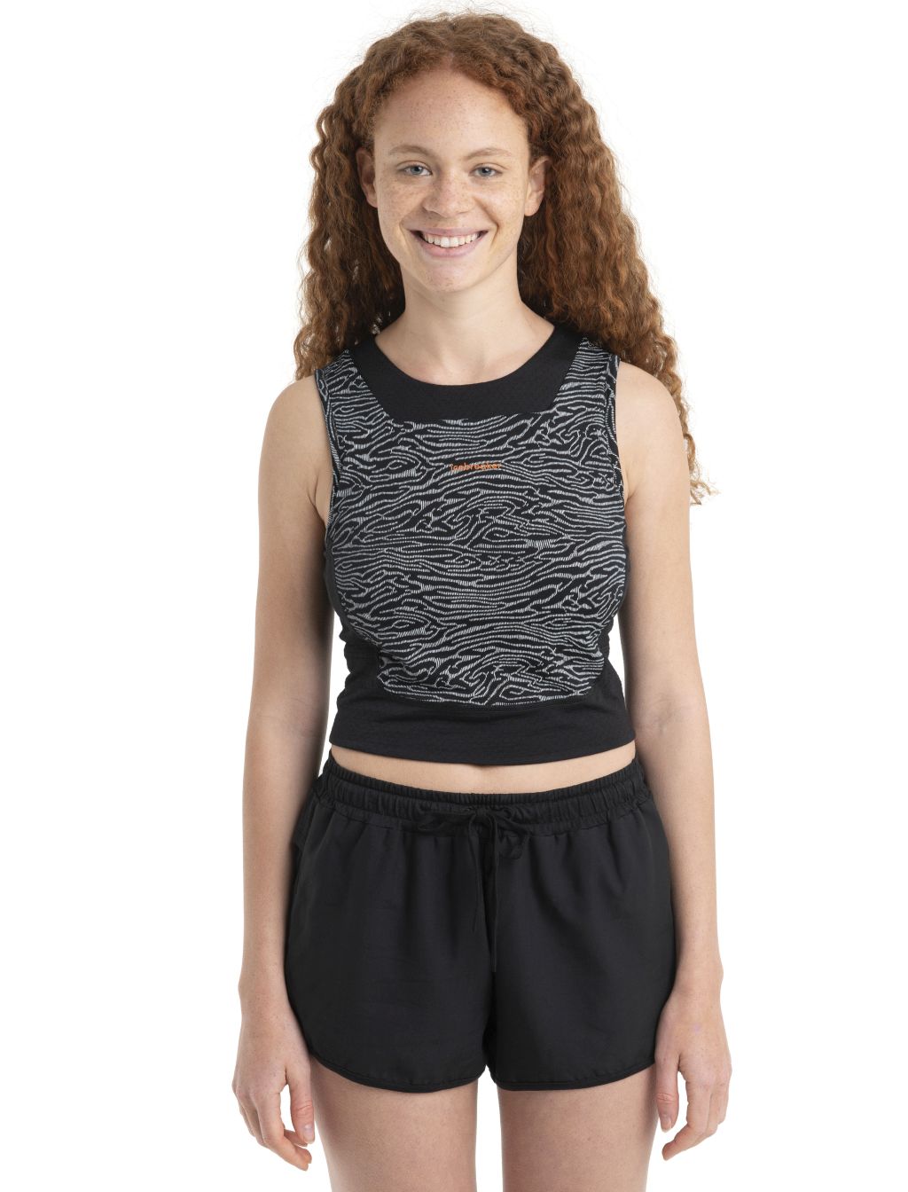 Dámské merino tílko s podprsenkou ICEBREAKER Wmns Merino 125 ZoneKnit Cropped BraTankTopo, Black/Snow/Aop velikost: S