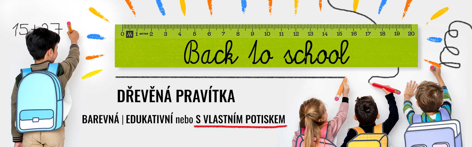 Dřevné pravítko v zelené barvě zobrazené na tabuli a kolem nj děti kreslí