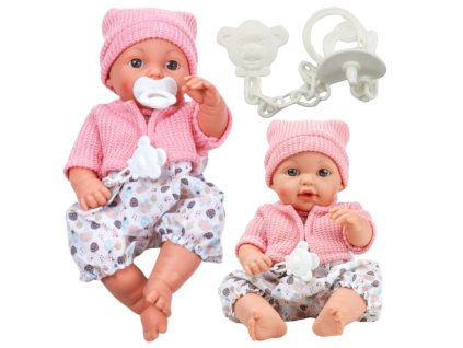 Bábika bobas v ružovom svetríku a čiapke s uškami, s cumlíkom a vzorovanými nohavicami, 30 cm, so smocíkom na retiazke.