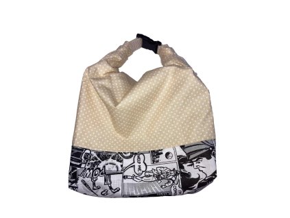 Füles zsák bézs pöttyös mintával és fekete-fehér képregény szegéllyel, összehajtva csatos zárral