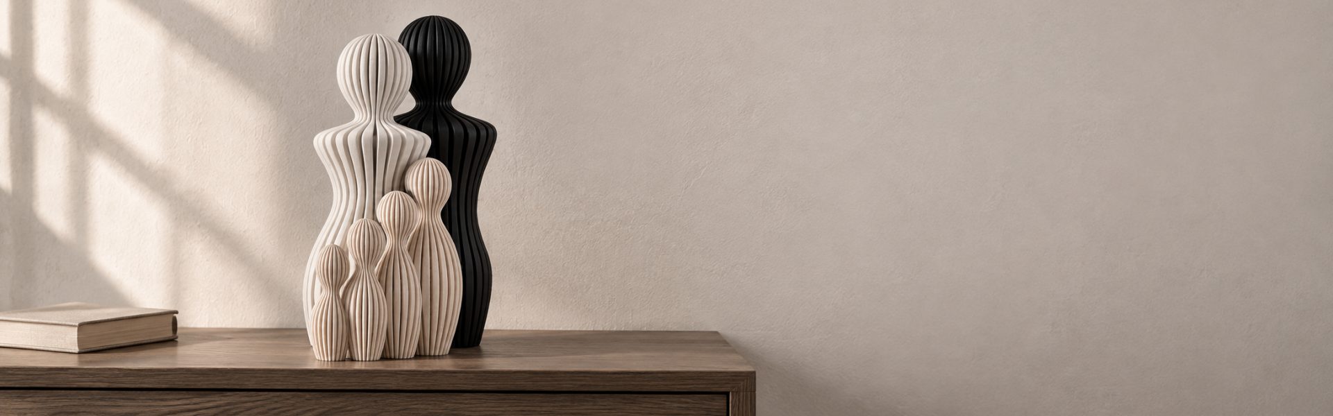 Designer family figurines on a wooden console