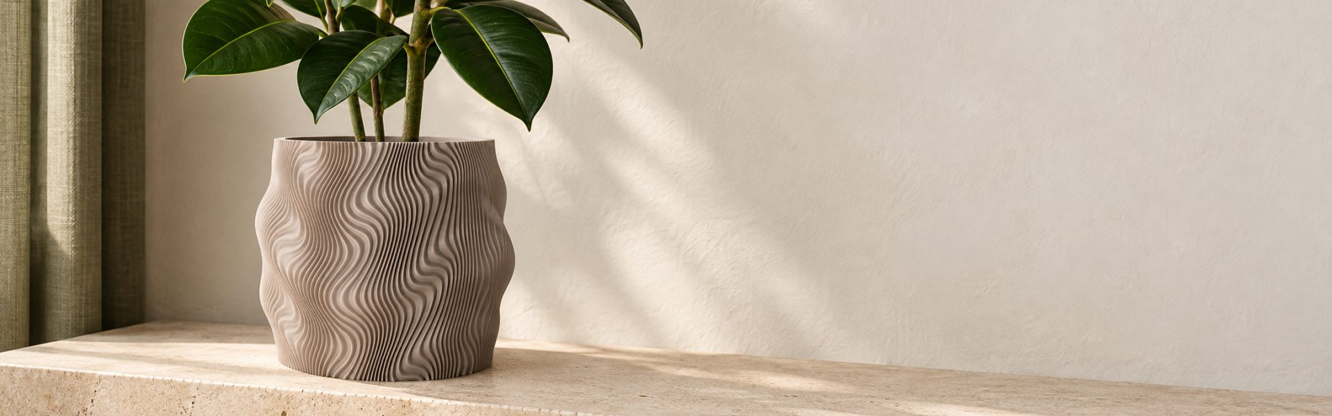 Atria designer planter with a plant in a modern interior
