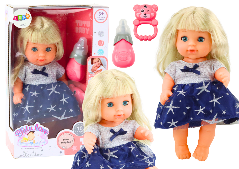 mamido  Bábika v tmavo modrých šatách s fľaštičkou, hrkálkou a zvuky cikajúce