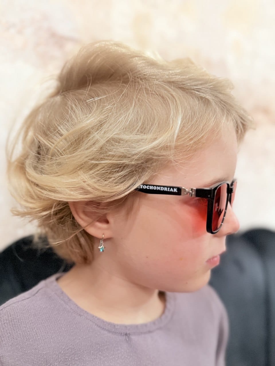 Kids Mitochondriak blue light blocking glasses worn by a child