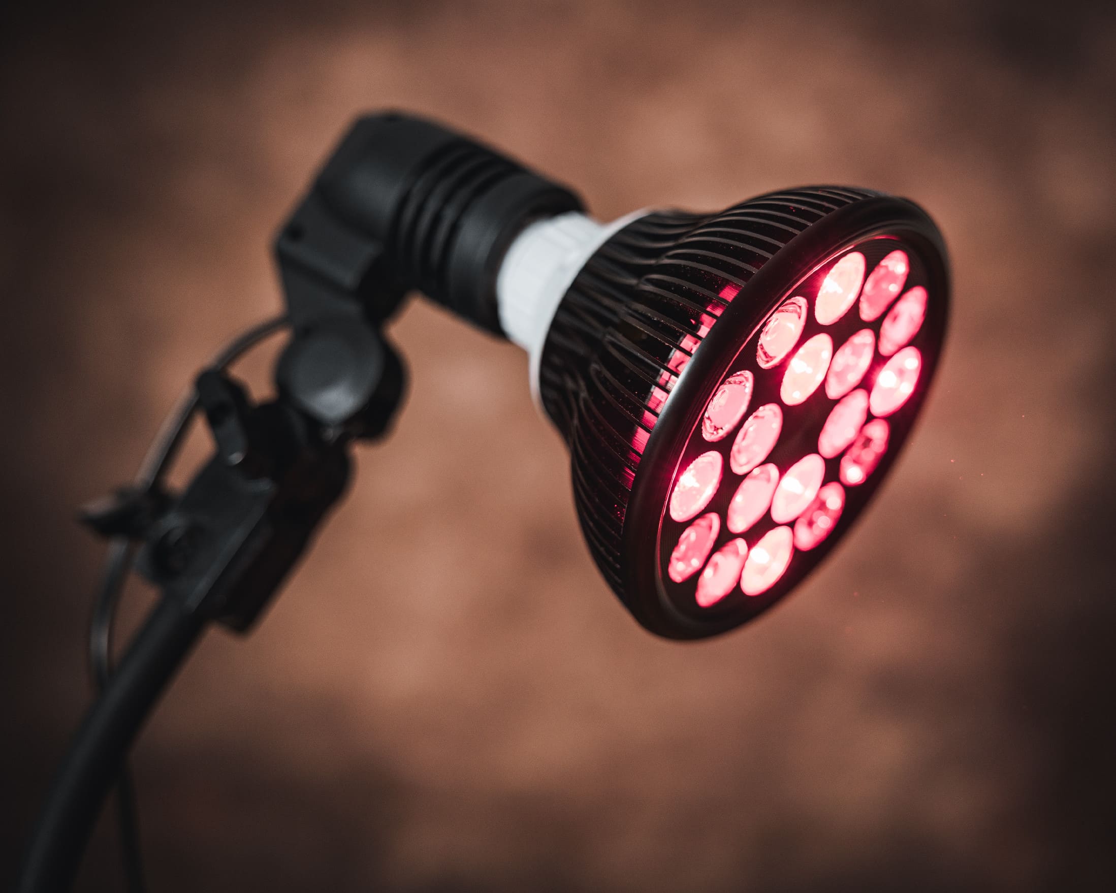 Closeup of LED therapy bulb Mitochondriak turned on during red light therapy