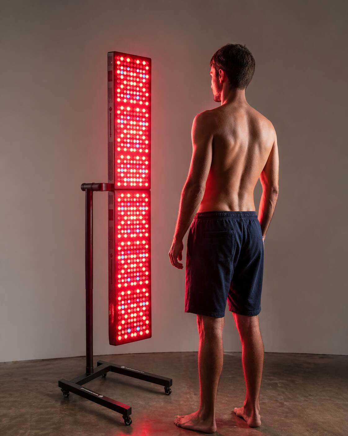 Man using the Mitochondriak Maxi UVB Upgraded panel for vitamin D therapy