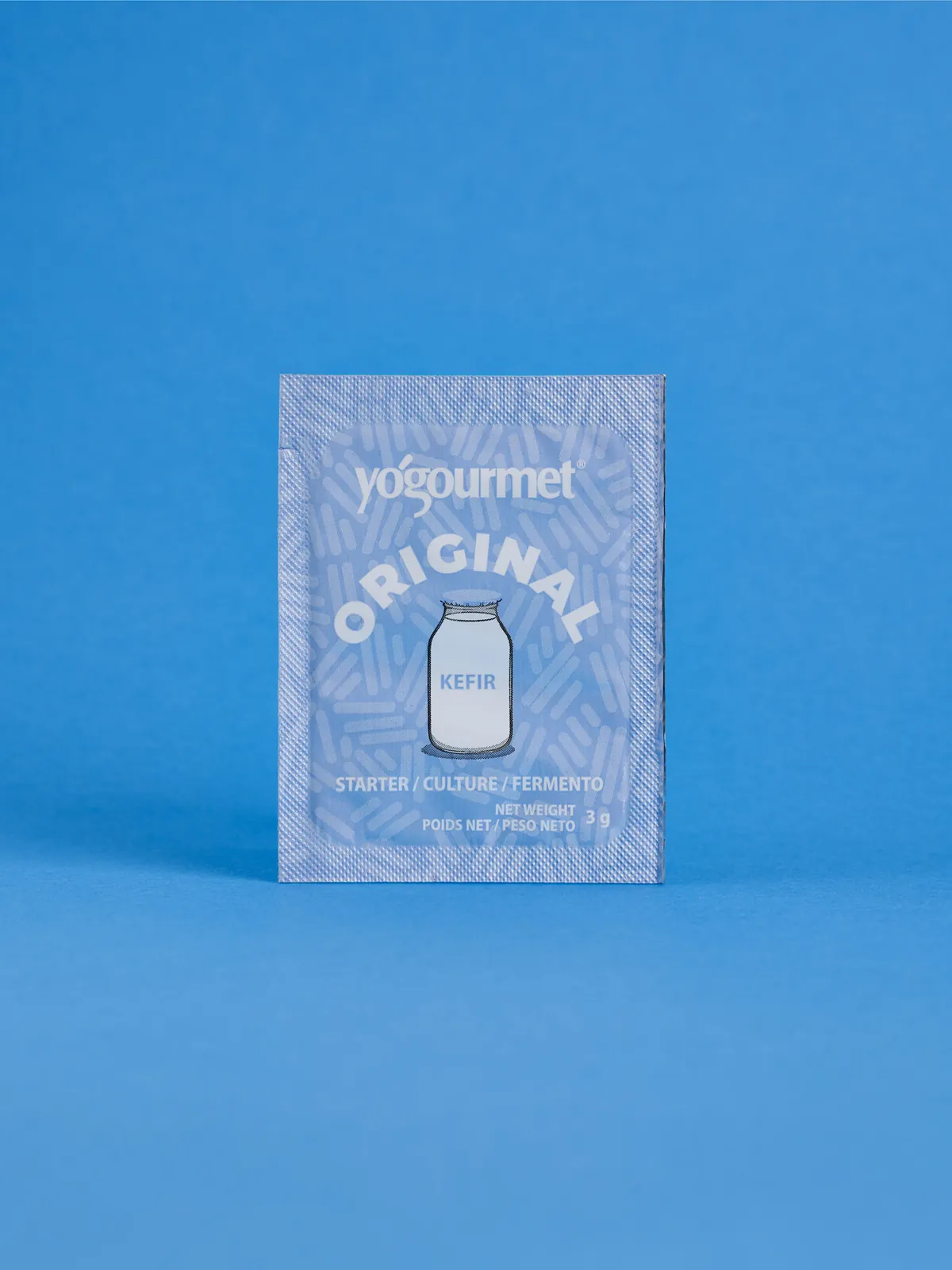 Modrý sáčok kefírovej kultúry Yogourmet Original na modrom pozadí