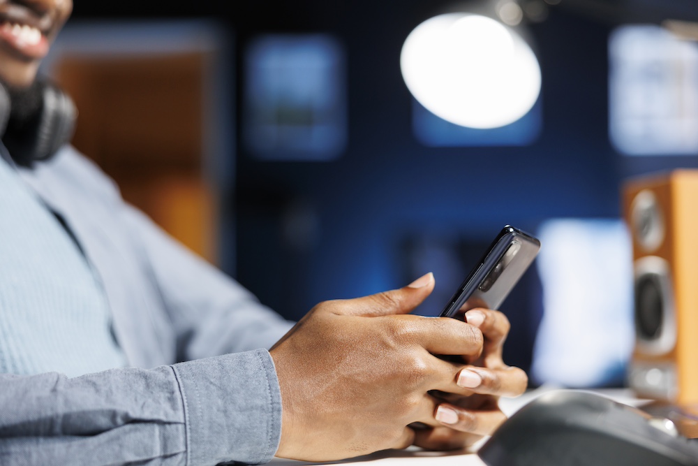 male-worker-examines-social-media-software-phone