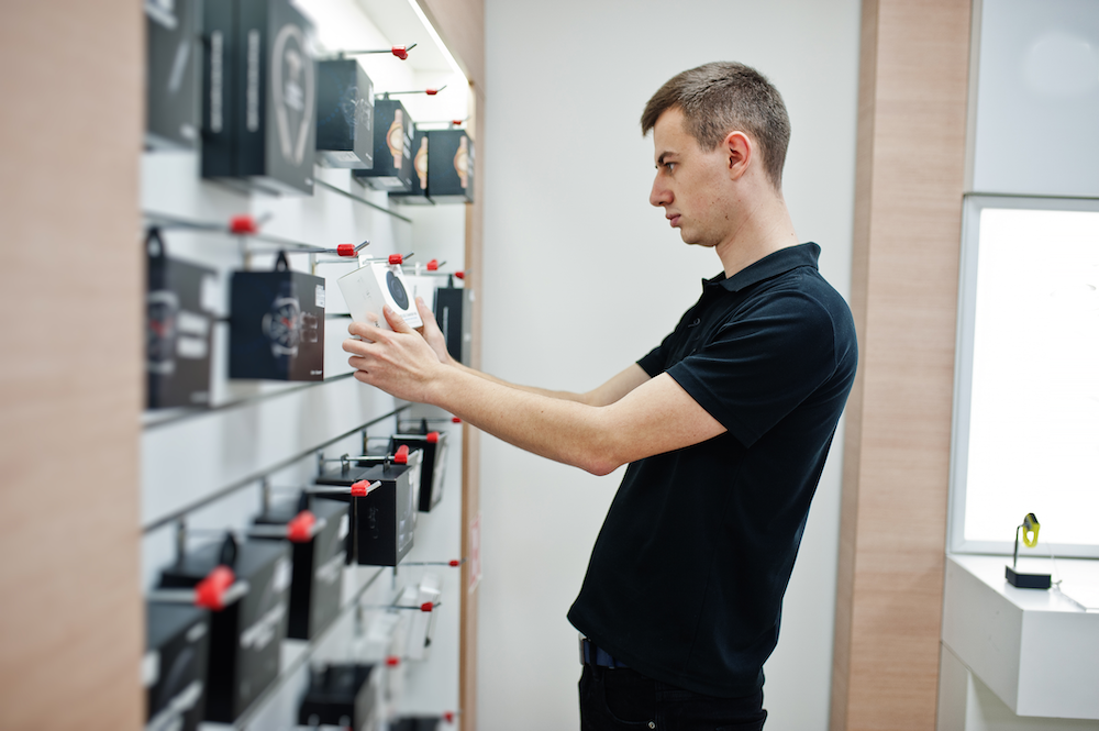 seller-man-mobile-phone-professional-consultant-tech-store-shop