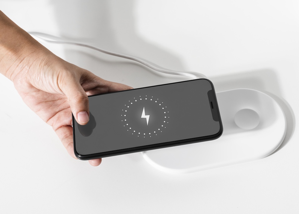hand-connecting-smartphone-wireless-charger
