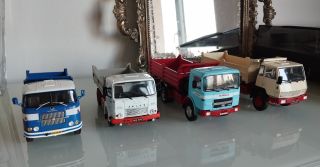 Four classic S3 three-way tipper truck models . Simple forms, working machines, and the quiet character of old-school...