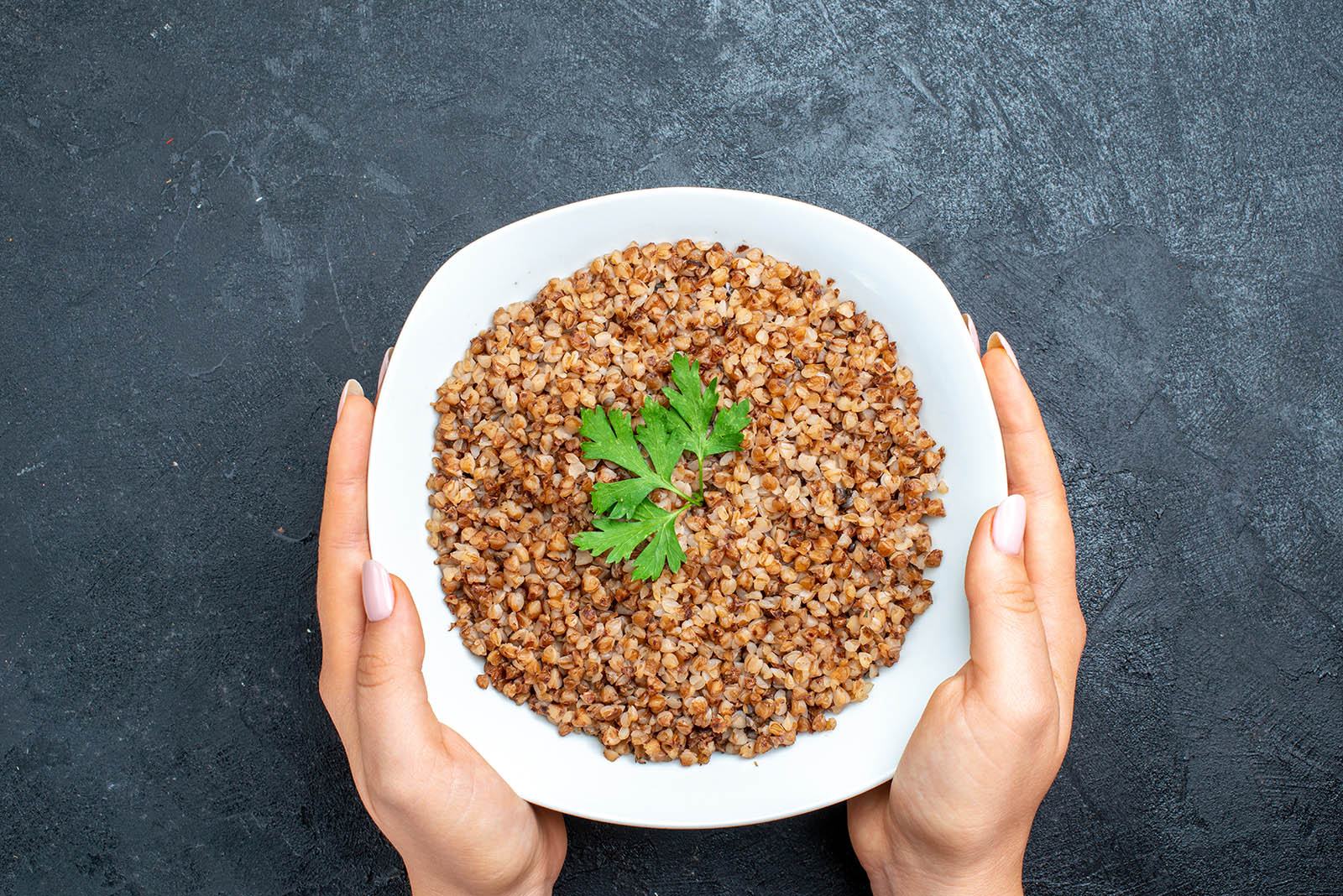 top-view-tasty-cooked-buckwheat-inside-plate-dark-grey-space