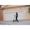 1183 4 ninebot max g3 e d lifestyle picture blurry house background riding