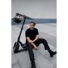 1183 5 ninebot max g3 e lifestyle picture guy sitting on kickscooter