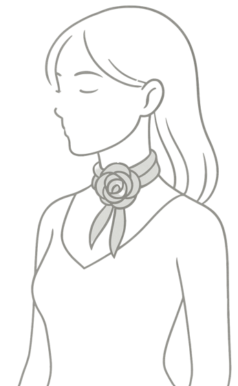 jak uvázat hedvábný šátek do květiny krok 6 Květ je pevně vytvarovaný ze spirál obtočených kolem uzlíku.  Konce šátku volně spadají dolů jako lístky – můžeš je lehce srovnat do šikma