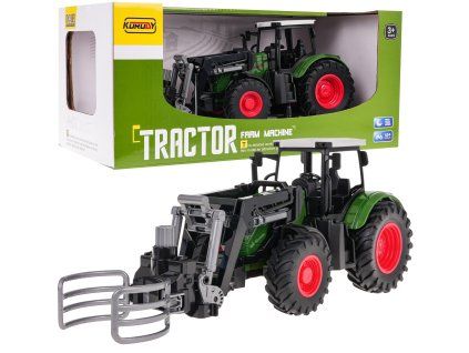 Zelený traktor s drapákem