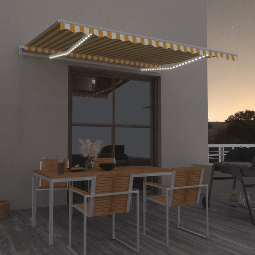 Levně vidaXL Ručně zatahovací markýza s LED světlem 450 x 350 cm žlutobílá