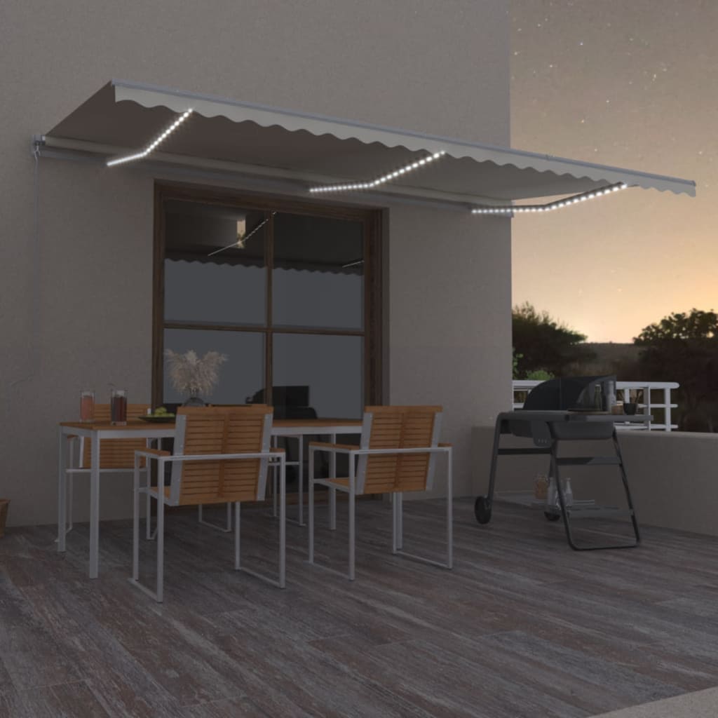 Levně vidaXL Ručně zatahovací markýza s LED světlem 600 x 350 cm krémová