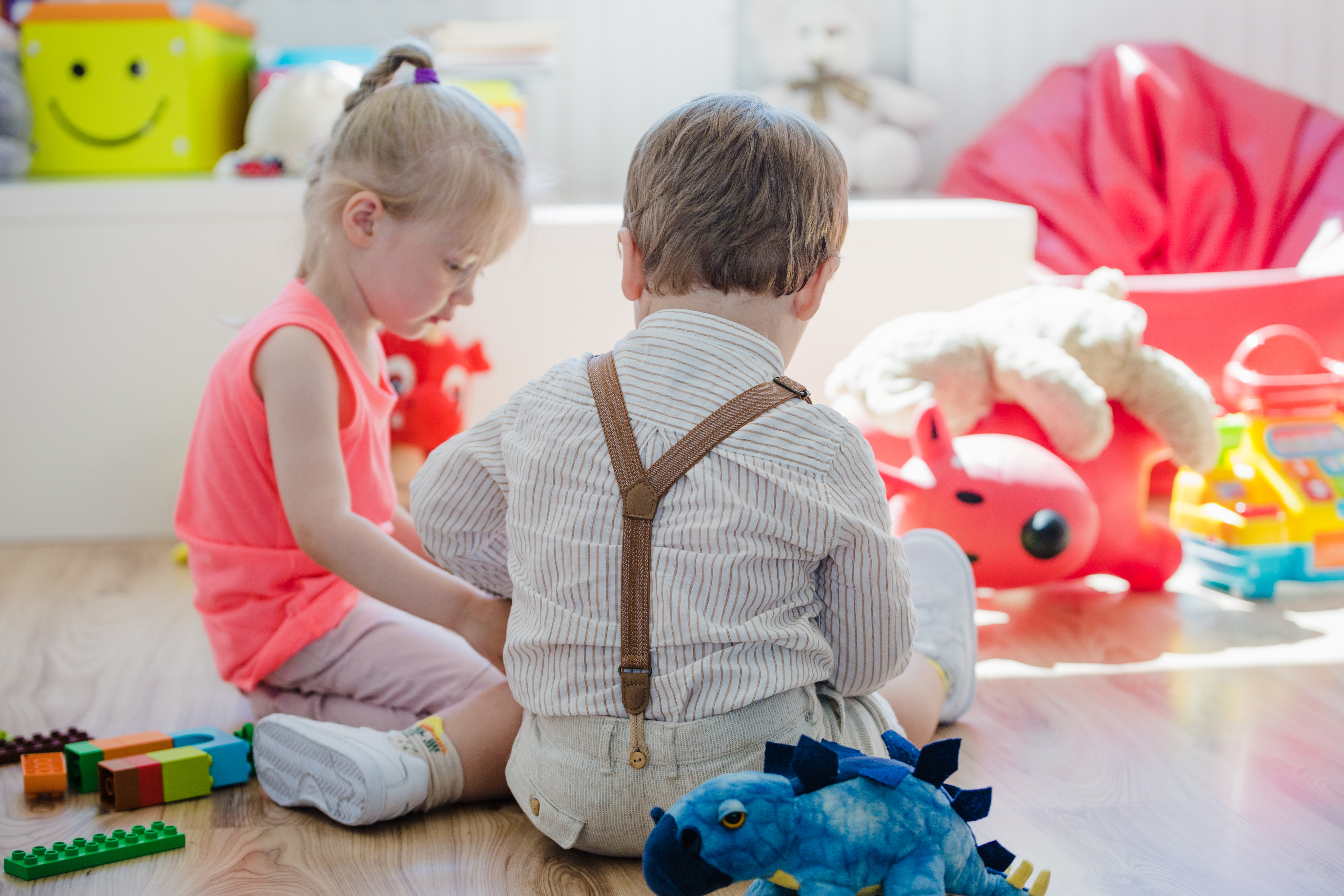 children-sitting-floor-playroom