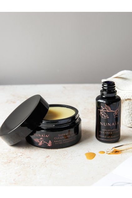 Nunaia Beauty Ground & Glow Ritual Set Lifestyle image with open bottle and jar ©2023