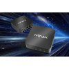 Dva Minix NR660 Mini PC letící na pozadí vesmíru.