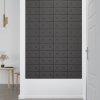 Nástěnné panely 12 ks šedé 30 x 15 cm umělá kůže 0,54 m² 343970