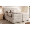 Boxspring postel BORA v ložnici – béžové čalounění a vysoké čelo postele