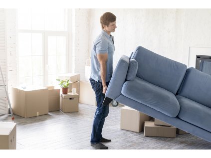 side view man handling couch while preparing move out