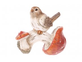 Ptáček sedící na oranžové houbě. Polyresin.