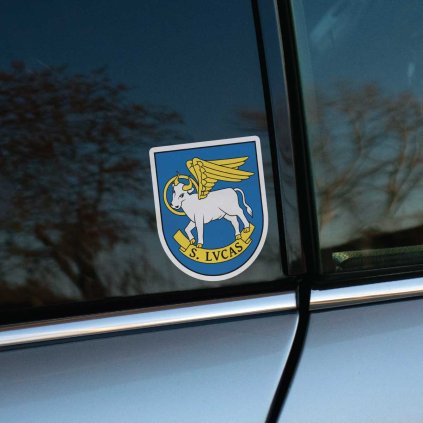 Tlačená nálepka na auto s erbom Devín, zobrazuje okrídleného býka s nimbom a nápisom S. LVCAS v heraldickom štíte.
