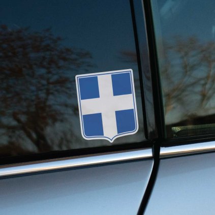 Tlačená nálepka erb Grécka so svetlým krížom na modrom štíte, decentný štátny motív vhodný ako nálepka na auto alebo kufor.